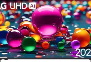 Smart TV LG UHD AI com design moderno e cores vibrantes exibindo uma cena de bolinhas coloridas em uma superfície líquida. A tela exibe as palavras 'LG UHD AI' e '2025' no canto superior esquerdo.
